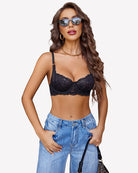 Black lace underwire bra with scalloped trim and mesh wings