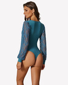 Teal lace long-sleeve leotard back view with sheer lace sleeves