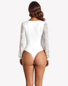 White lace long-sleeve leotard back view with sheer lace sleeves