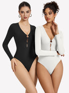 Black and white deep V-neck long-sleeve bodysuits with keyhole cutout at bust