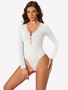 White plunge V-neck long-sleeve bodysuit with center keyhole cutout detail