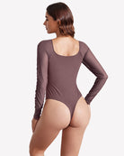 Dark mauve long-sleeve ruched shapewear bodysuit with mesh-like texture