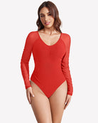 Red long-sleeve ruched shapewear bodysuit with V-neckline