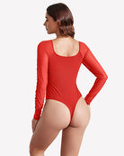 Red long-sleeve ruched shapewear bodysuit with scoop back