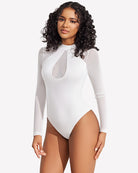 White mesh long-sleeve bodysuit with teardrop chest cutout and high-leg bottom