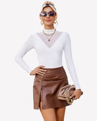 Long-sleeve mock turtleneck leotard in white with v-neck mesh panel detail