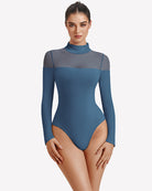 Long-sleeve turtle neck leotard in blue with sheer side and back panels
