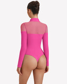 Long-sleeve turtle neck leotard in bright pink, back view with sheer side panels