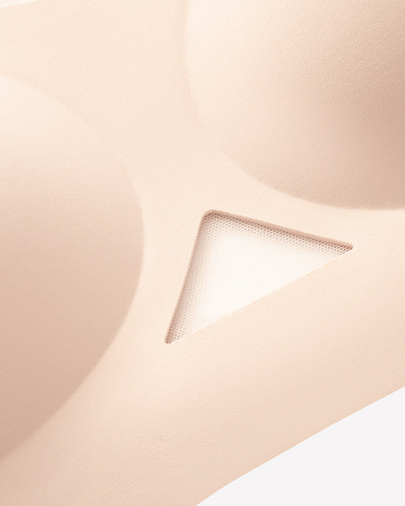 Nude mesh padded bralette close-up of triangular mesh insert and smooth cups