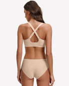 Nude padded bralette bra with mesh cups and crossed back straps