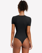 Black short-sleeve snap bodysuit, scoop back, fitted one-piece leotard.