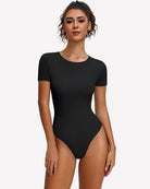 Black short-sleeve snap bodysuit, scoop neck, fitted one-piece leotard.