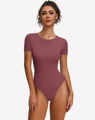 Rose red short-sleeve snap bodysuit, scoop neck, fitted one-piece leotard.