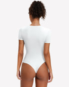 Short-sleeve snap bodysuit, white back view with smooth fitted silhouette and thong-style back.