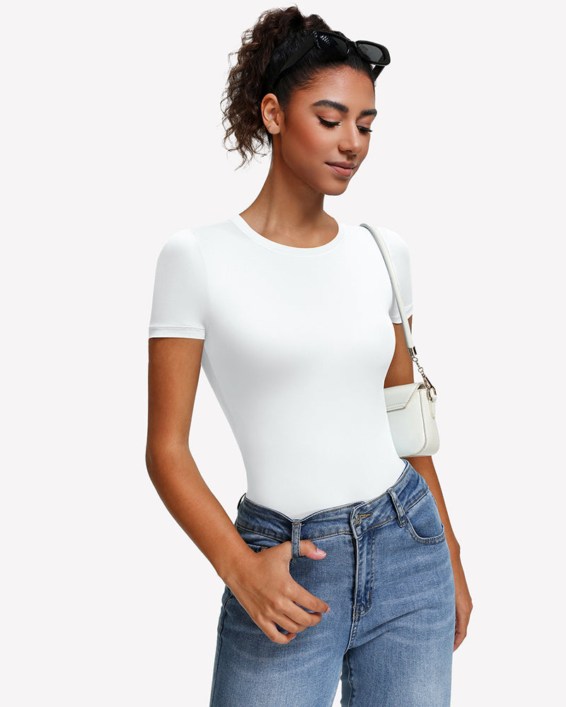 Short-sleeve snap bodysuit, white with short sleeves and snap closure, paired with jeans.