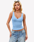 Double-lined plunge V-neck tank top in light blue, sleeveless with fitted waist