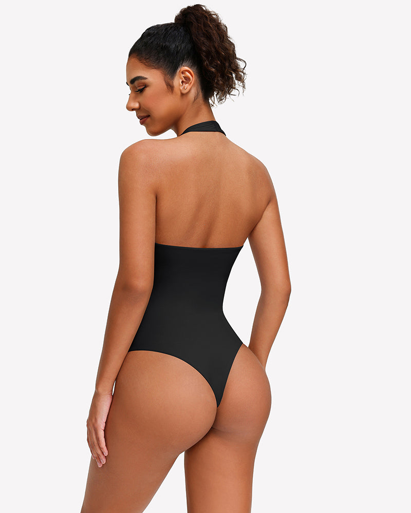 Back view of black halter bodysuit with open back and high-cut coverage
