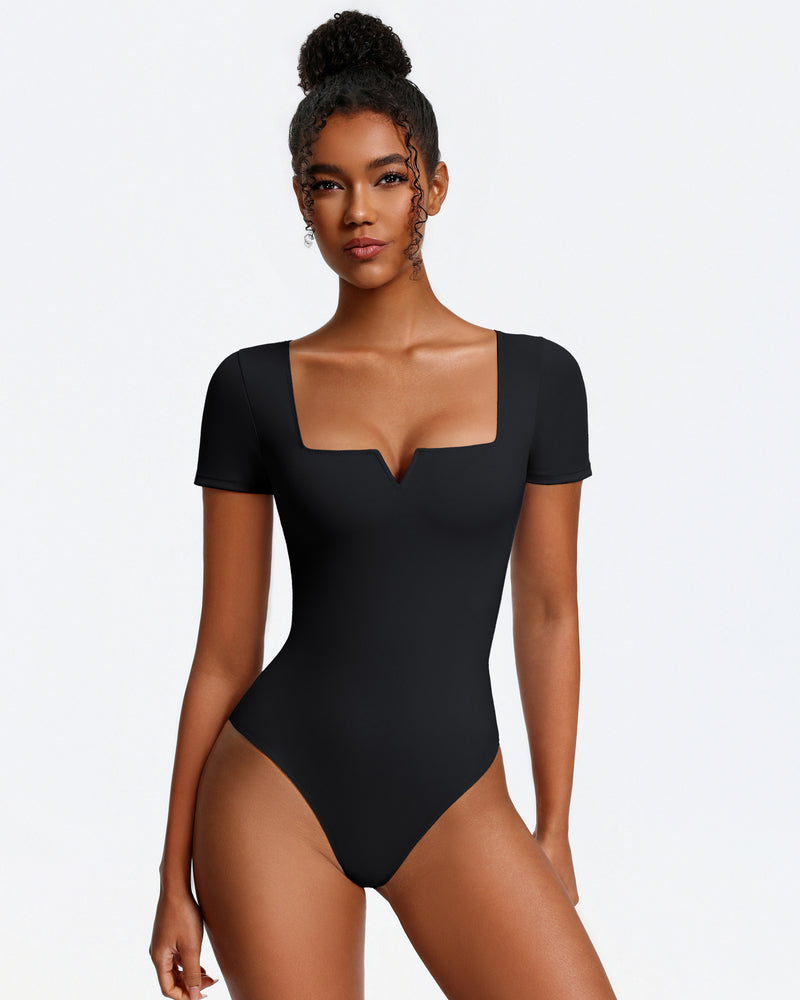 Black short-sleeve square-neck bodysuit, fitted one-piece with thong bottom.