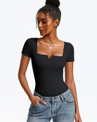 Black short-sleeve square-neck bodysuit, fitted one-piece with thong bottom.