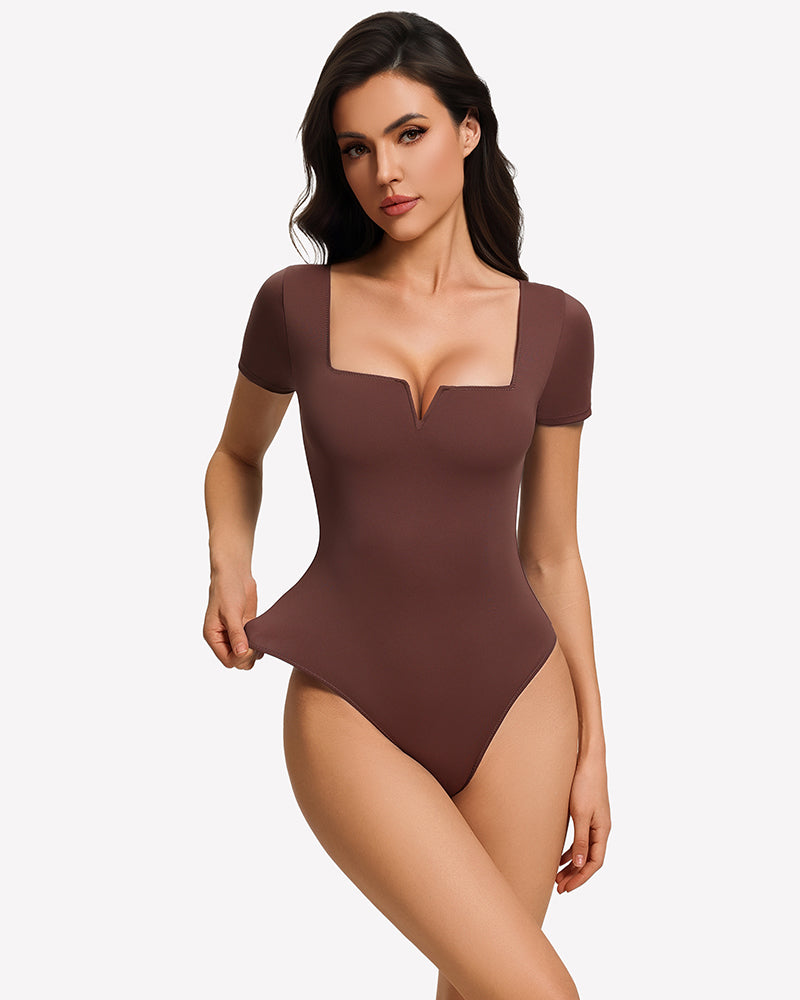 Brown short-sleeve square-neck bodysuit, fitted one-piece with thong bottom.