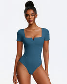 Blue short-sleeve square-neck bodysuit, fitted one-piece with thong bottom.