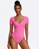 Pink short-sleeve square-neck bodysuit, fitted one-piece with thong bottom.