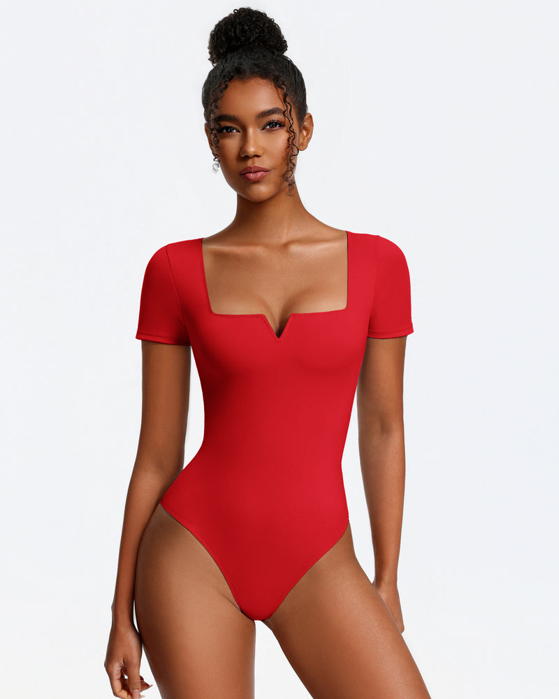 Red short-sleeve square-neck bodysuit, fitted one-piece with thong bottom.
