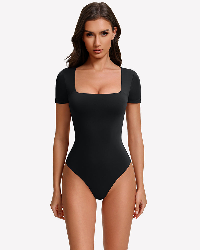 Square-neck short-sleeve bodysuit in black, fitted one-piece with thong-style leg openings.