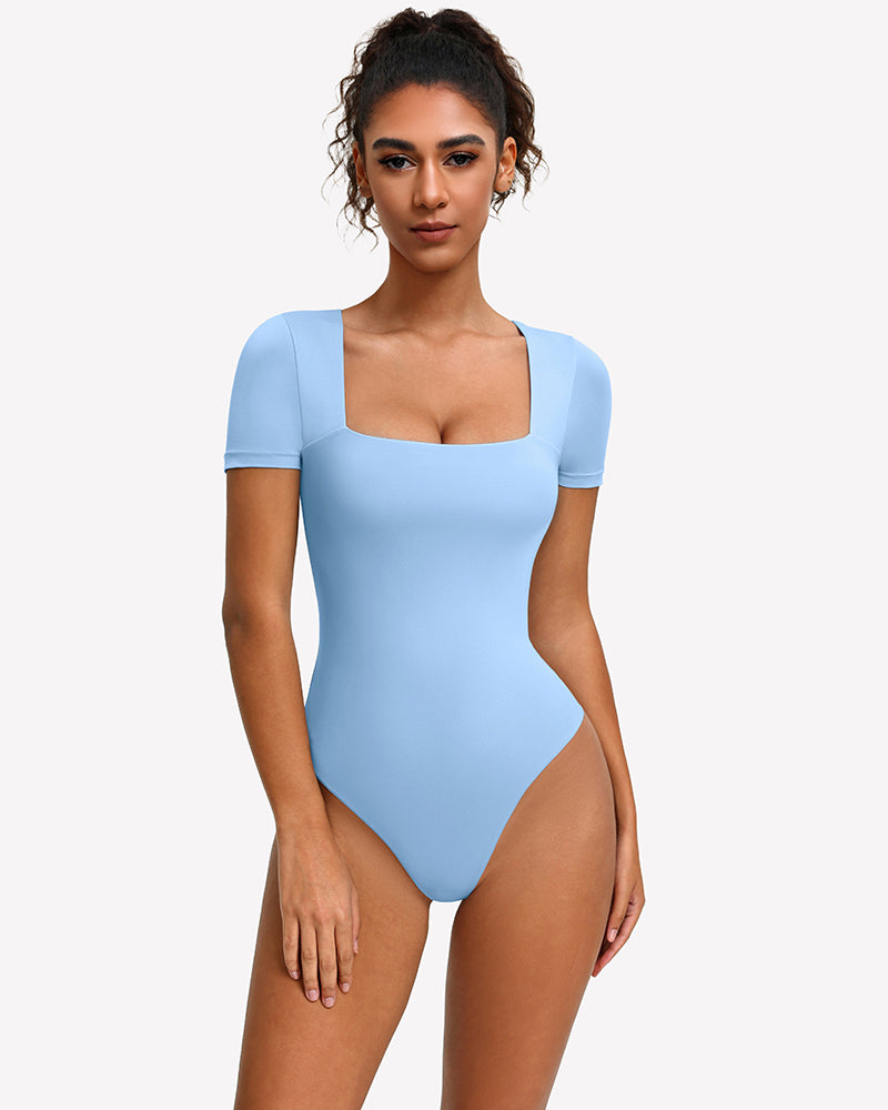 Square-neck short-sleeve bodysuit in light blue, fitted one-piece with thong-style leg openings.