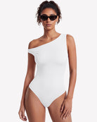 White off-shoulder asymmetric bodysuit with one-shoulder neckline and fitted leg openings