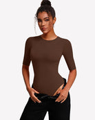 Brown fitted crew-neck bodysuit with 3/4 sleeves and snap closure