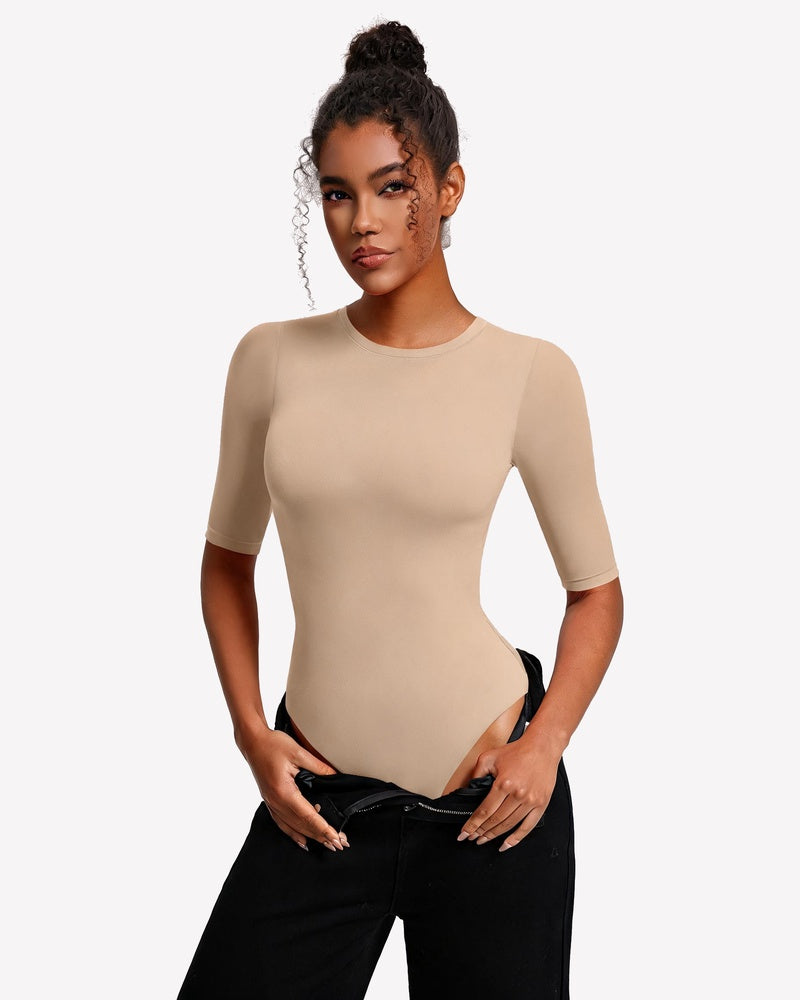 Nude beige fitted crew-neck bodysuit with 3/4 sleeves and snap closure