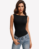 Boat-neck double-lined sleeveless bodysuit, black, smooth fitted front under jeans.