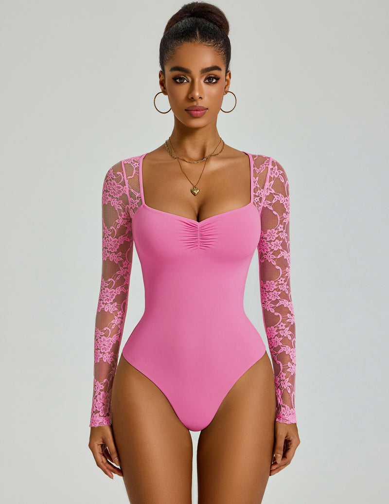 Pink sweetheart lace long-sleeve bodysuit with ruched front.