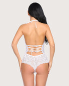 White lace halter one-piece with open back and crisscross lacing over lace briefs
