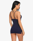 Navy lace-trim slip chemise with spaghetti straps, open back, and tie sides