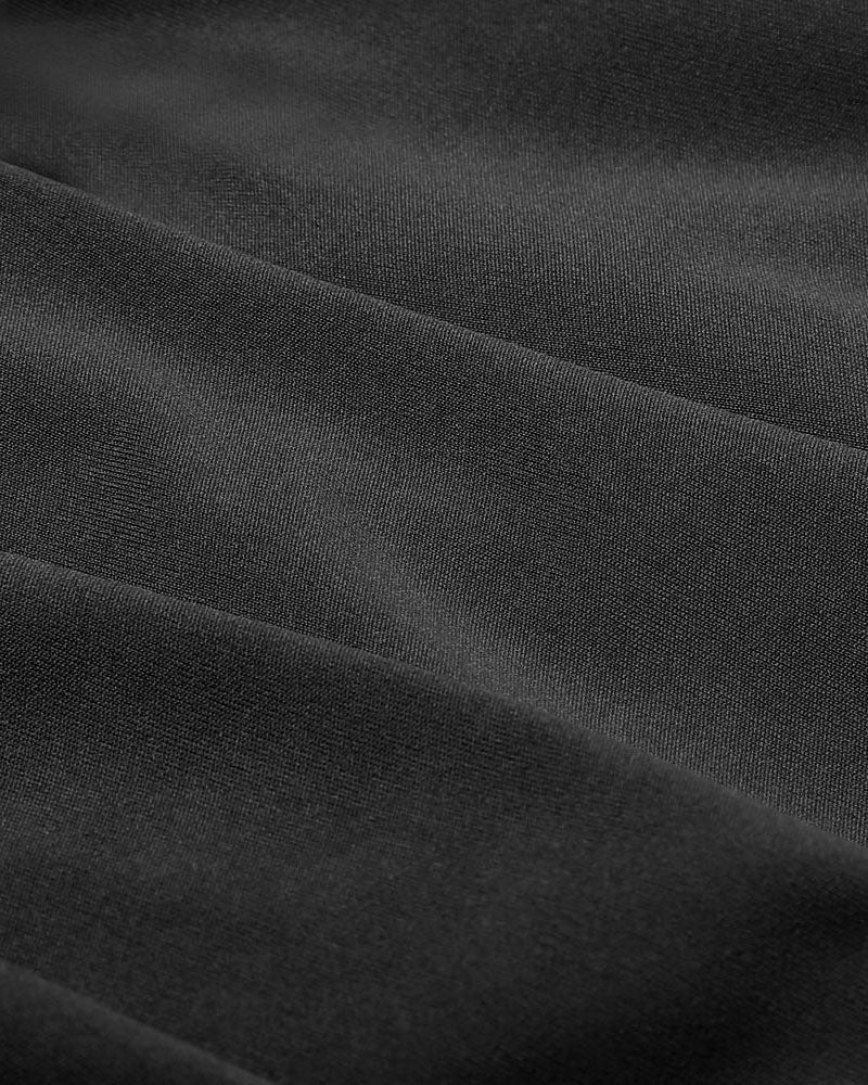 Close-up of black woven fabric with fine texture.
