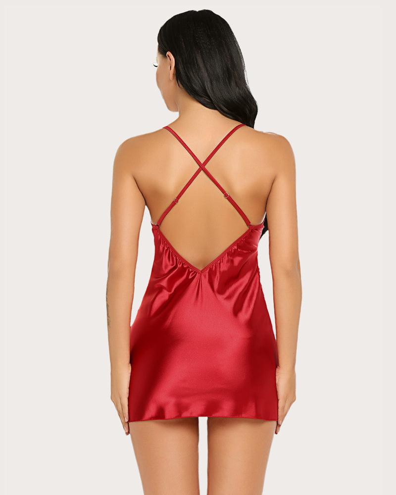 Red satin chemise with crossed back straps and lace-trim neckline