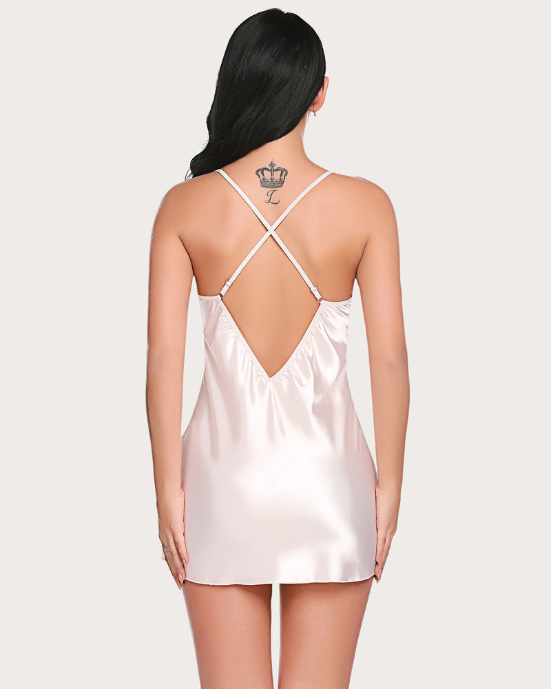 White satin chemise with crisscross back straps and lace-trim neckline
