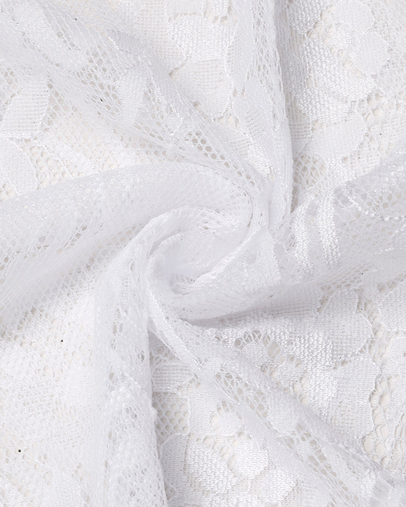 White lace fabric detail with floral embroidery and sheer mesh backing
