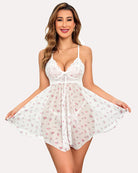 White babydoll nightgown with lace bodice, tie front, and floral print skirt