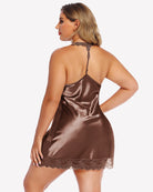 Brown satin lace nightgown with open back and lace-trimmed hem, thin straps.