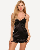 Black satin pajama set with lace-trim camisole and matching lace-trim shorts