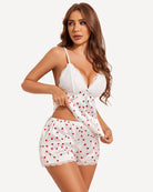 White lace-trim satin pajama set with red hearts, bra top and ruffle shorts