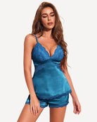 Blue satin pajama set with lace V-neck cami top and matching lace-trim shorts