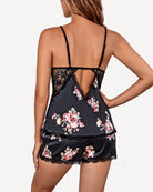 Back view of dark navy floral satin pajama shorts set with lace straps and cutout