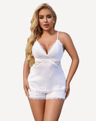 Lace-trim satin pajama set with white lace camisole and matching short, scalloped lace hems.