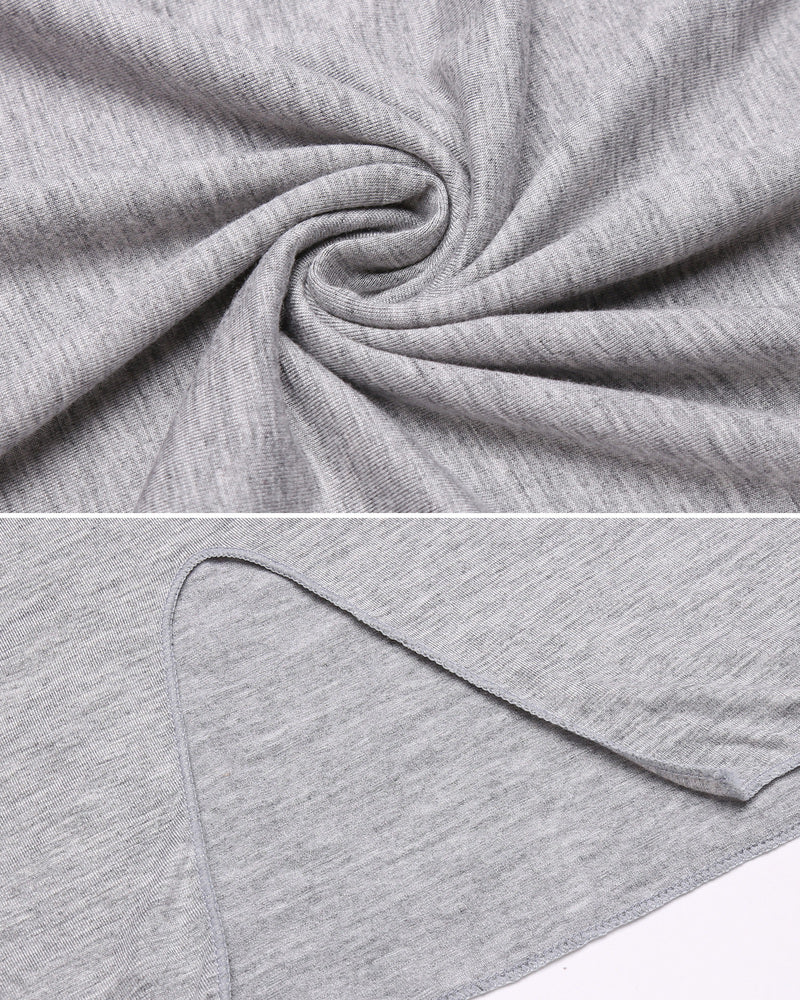 Heather grey knit fabric close-up with folded texture and stitched edge