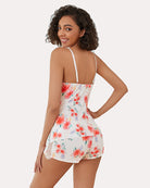 White lace-trim cami pajama set with red floral print, shown from the back