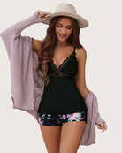 Black lace-trim cami and floral shorts pajama set, fitted bodice and lace trim